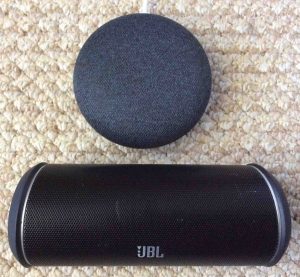 The Flip 2 Bluetooth speaker with a smart speaker.