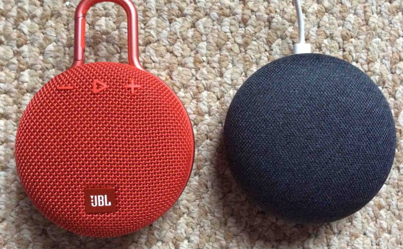 Picture of a JBL Clip 3 Bluetooth speaker with a Google Home Mini smart speaker.