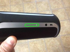 Picture of the JBL Flip 2 wireless speaker battery status gauge, circled, showing the battery almost dead. Needs charging.