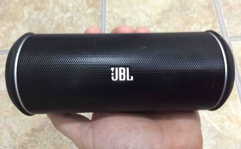 Picture of the JBL Flip 2 Bluetooth speaker, front side view, held in hand.