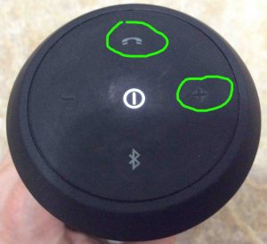 Picture of the speaker's button panel, with the -Volume UP- and -Phone- buttons circled.