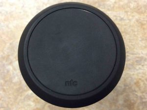 Picture of the JBL Flip 2 wireless speaker, showing the NFC antenna end view, close up.