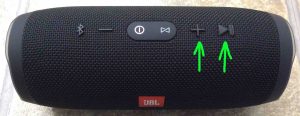JBL Charge 3 buttons layout guide. Picture of the JBL Charge 3 IPX7 speaker, showing its Volume Up and Play Pause buttons highlighted.