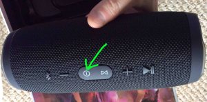 Picture of the speaker, powered off. Showing the -Power- button highlighted.