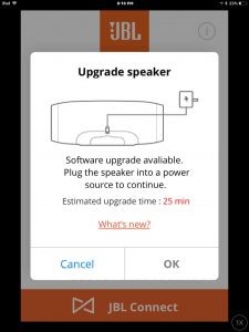 Screenshot of the JBL Connect app on iOS, prompting to plug in the speaker to AC power to update its software.