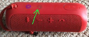 Picture of the JBL Flip 3 battery operated speaker, showing its -Infinity- button highlighted.