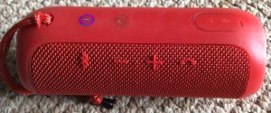 Picture of the JBL Flip 3 Bluetooth speaker, view of the buttons panel. JBL Flip 3 Bluetooth wireless speaker, red version, front view. 