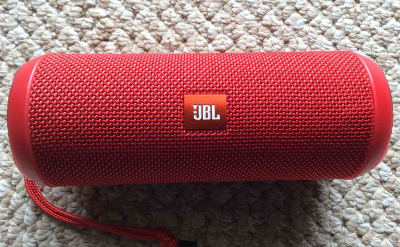 Picture of the JBL Flip 3 Bluetooth wireless speaker, red version, front view.
