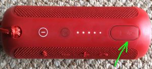 Picture of the JBL Flip 3 Bluetooth wireless speaker. Showing The USB AUX IN ports door closed and highlighted. How to Charge JBL Flip 3 splashproof Bluetooth speaker.