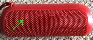 Picture of the JBL Flip 3 wireless speaker. Showing its Bluetooth pairing button highlighted.