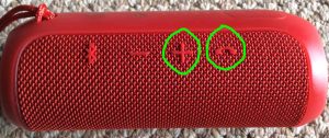 Picture of the JBL Flip 3 wireless Bluetooth speaker, showing the reset button combination circled.