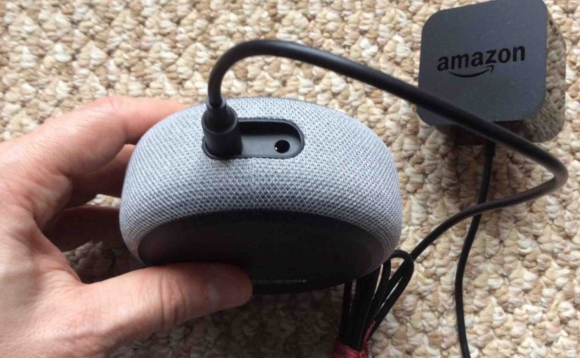 Picture of the Amazon Echo Dot gen 3 speaker AC power adapter, plugged into speaker back.