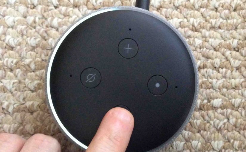 Picture of the Alexa Amazon Echo Dot 3 speaker light ring, showing one half volume. Finger setting volume.