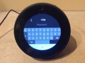 Picture of the Alexa Echo Spot WiFi smart speaker, prompting for Amazon account password.