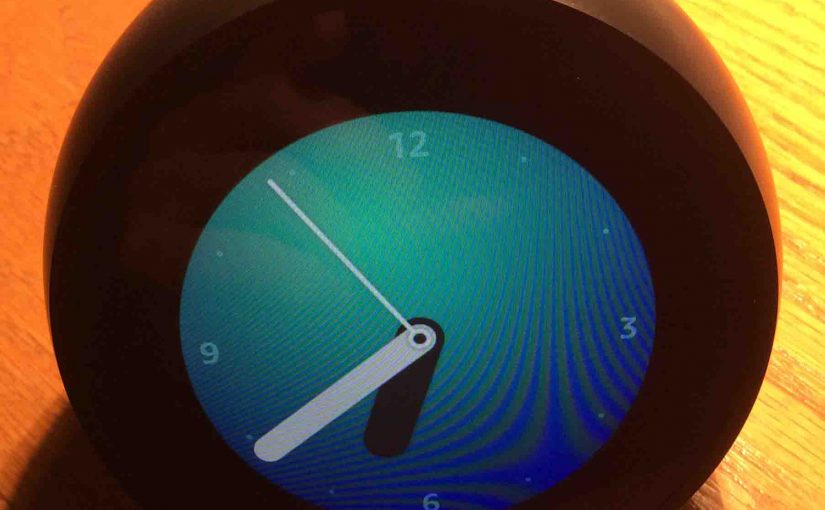 Picture of the Amazon Echo Spot speaker showing home screen, with mics unmuted.