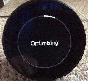 Picture of the speaker, showing the start of its Optimizing operation. Echo Spot Firmware Update.
