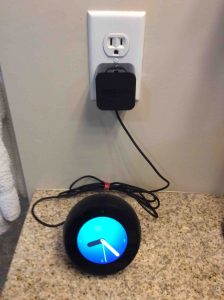 Picture of the Echo Spot speaker, displaying a home screen.