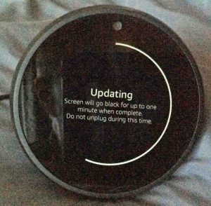 Picture of the speaker as updating the firmware continues, at 55 percent done. Updating Firmware on Echo Spot.