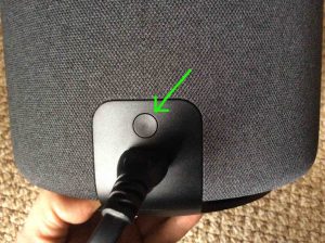 Picture of the Alexa Echo Sub woofer, showing the rear view with its Action button highlighted. Echo Sub reset.