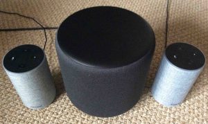 Picture of the Alexa Echo Sub with a pair of Amazon Echo 2nd gen smart speakers.
