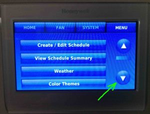 Picture of the Honeywell RTH9580WF WiFi thermostat, displaying its Main menu, top of page, with the -Scroll Down- button highlighted.