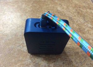 Picture of a USB charging cable plugged Into this little speaker. 