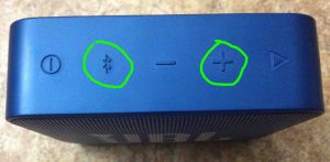 Right side picture view of the speaker, showing the -Bluetooth- and -Volume Up- buttons circled. How to Reset JBL Speaker.