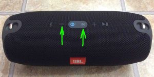 Picture of the JBL Xtreme portable Bluetooth speaker, top view, showing the -Volume DOWN- and -Connect- buttons highlighted. 