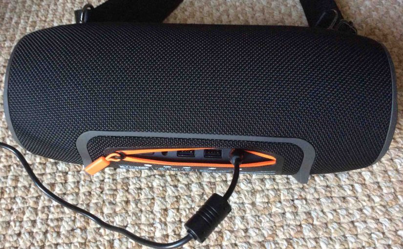 Picture of the Xtreme JBL speaker back view, showing the DC charging cord inserted.