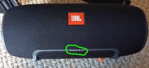 Picture of the Xtreme JBL speaker front view, showing the battery gauge circled with all its lights glowing This means that the Speaker is fully or almost fully charged.
