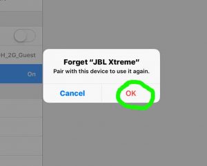 Screenshot of our iOS tablet computer, displaying the -Forget JBL Xtreme Bluetooth Device- prompt, with the -OK- button highlighted. 