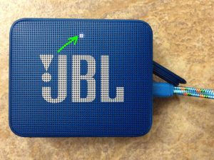 Picture of the JBL Go 2 showing as fully charged, with its steady glowing or blinking white lamp.
