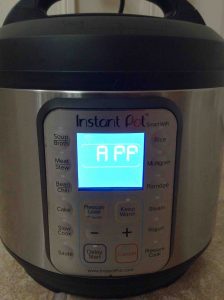 Picture of the The Instant WiFi Pot, front view, showing what the LCD screen looks like when the cooker is in APP mode, and ready for WiFi setup. 