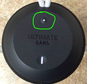 Picture of an Ultimate Ears model, top view, showing its -Bluetooth- button circled.