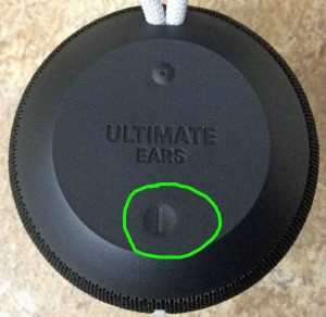 Picture of the Ultimate Ears speaker powered OFF, top view, showing the -Power- button circled.