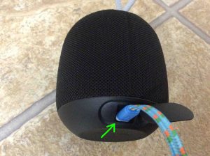 Picture of the Ultimate Ears Wonderboom Bluetooth speaker back view, with charging cord connected and highlighted.