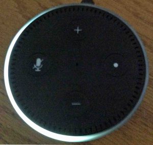 Picture of the Echo Dot 2 speaker, top view. The light ring shows volume set at half.
