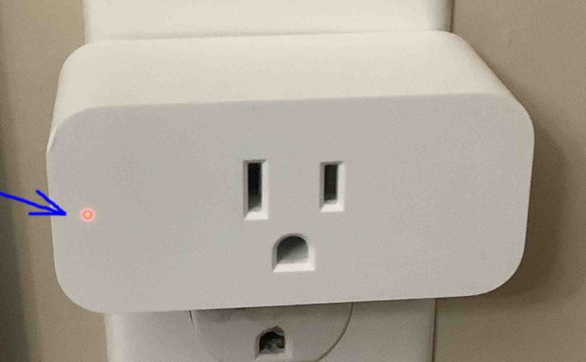 Picture of the Amazon Smart Plug, front view, during reset, its lamp flashes red.