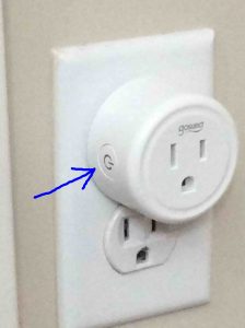 Picture of the left front of the Gosund mini smart plug, with the Action button highlighted.