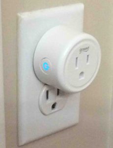 Picture of the plug, left front view, showing the Action button flashing blue.