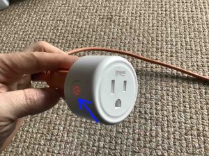 Gosund Mini WiFi Outlet Setup: Picture of the Gosund smart mini plug, powered ON, showing the red glowing Action button highlighted.