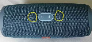 Picture of the JBL Charge 4 power bank speaker, top view, showing the Volume DOWN and UP buttons circled.