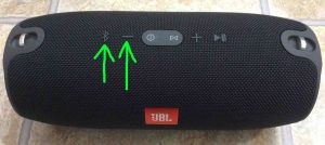 Picture of the JBL Xtreme BT speaker, top view, showing the -Bluetooth- and -Volume Down- buttons highlighted.