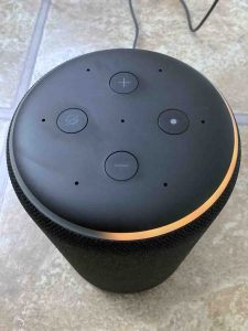 Top view of this Amazon smart speaker, showing the spinning orange light ring.