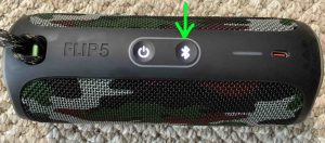 Top view of a typical Bluetooth speaker, showing the flashing Bluetooth button highlighted. How to Pair JBL Flip 5 with Alexa.