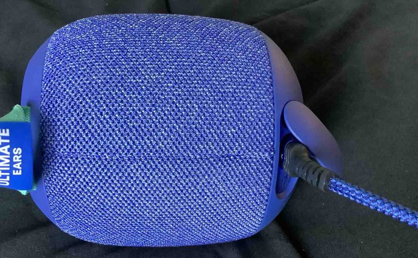 Back view of the Ultimate Ears Wonderboom 2 speaker, showing the charging cord connected.