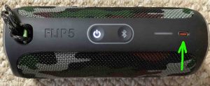 Top view of the JBL Flip 5 speaker, showing the USB-C charging port highlighted.