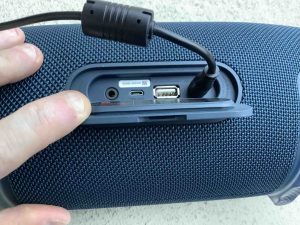 Picture of the back of the JBL Xtreme 2, showing the charger plug inserted.