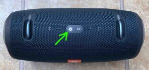 Top view of the speaker powered ON, but not paired, with its -Power- button highlighted.