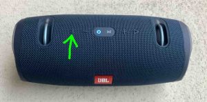 Picture of the speaker with the Bluetooth button highlighted and just pressed, showing the Power button blinking blue.